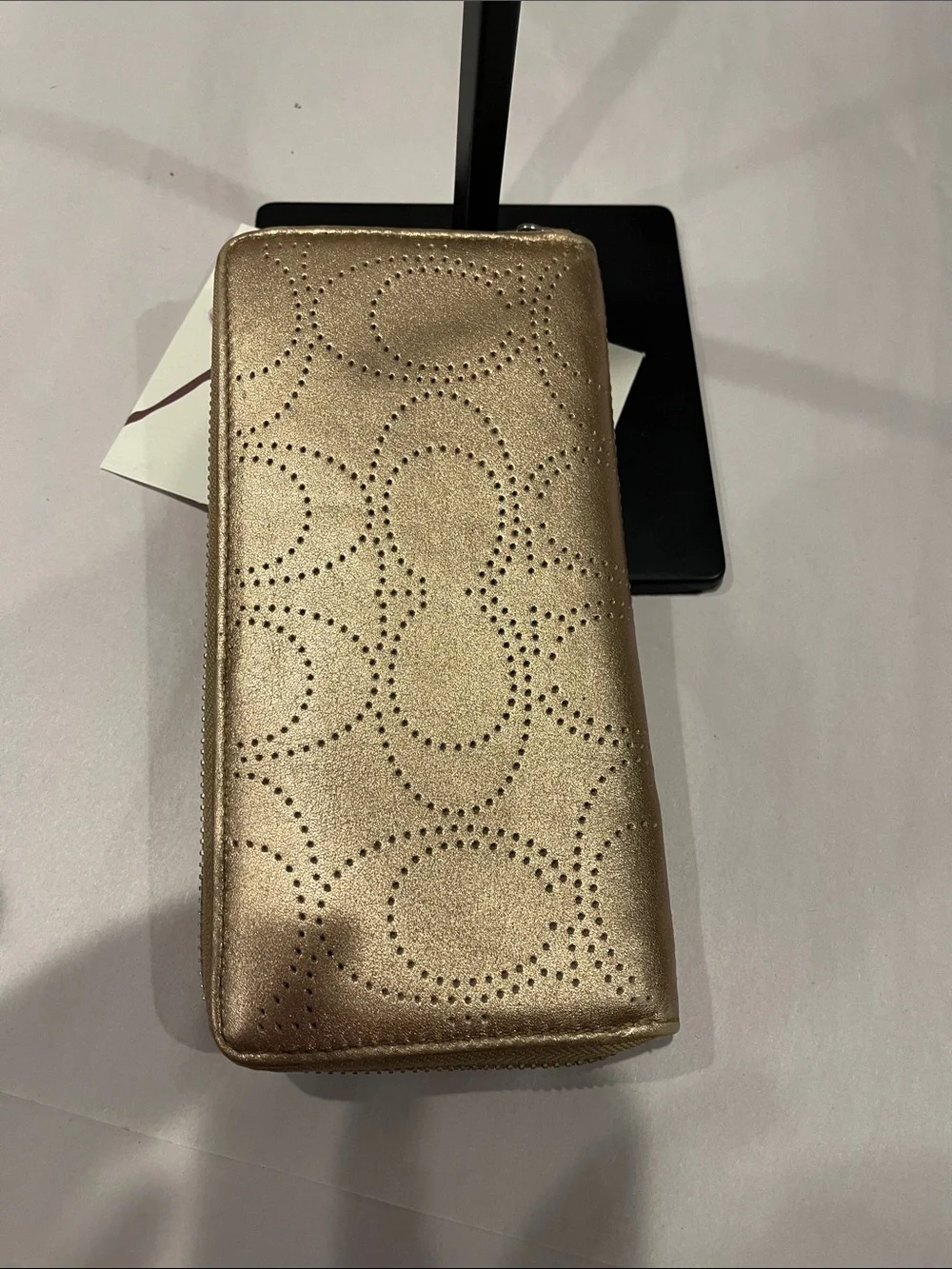 Coach Ashley perforated zip-around wallet.